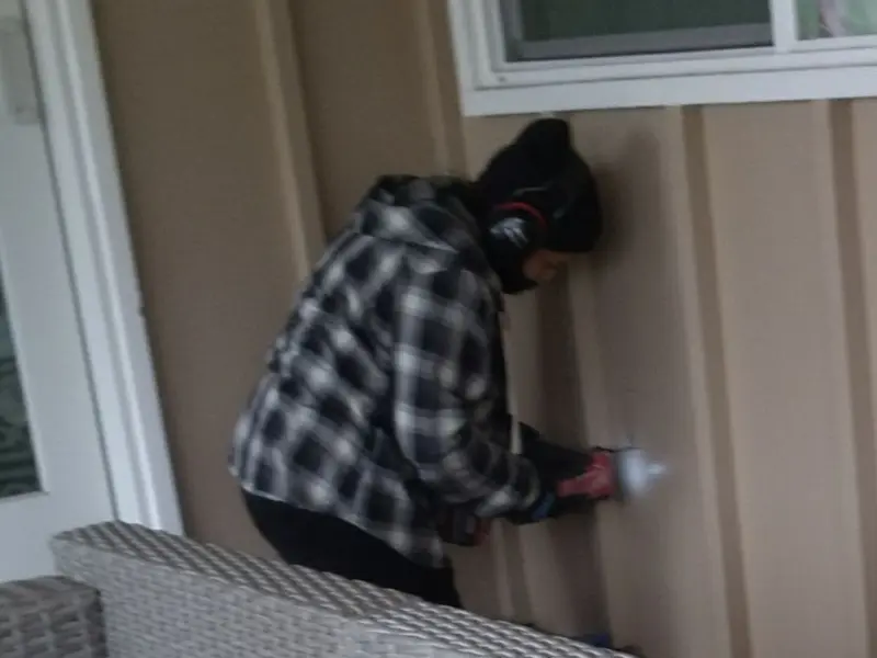 Professional electrician installing an exterior outlet in Mount Hermon